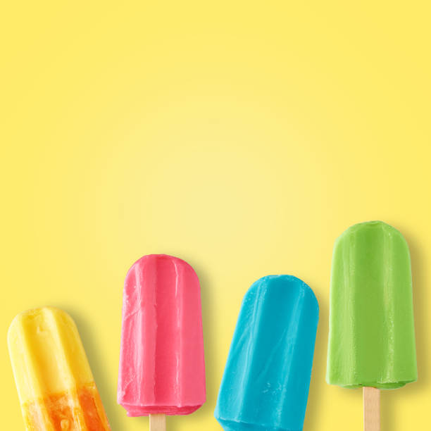 istock Colorful ice cream popsicles on yellow background, top view 1327066125