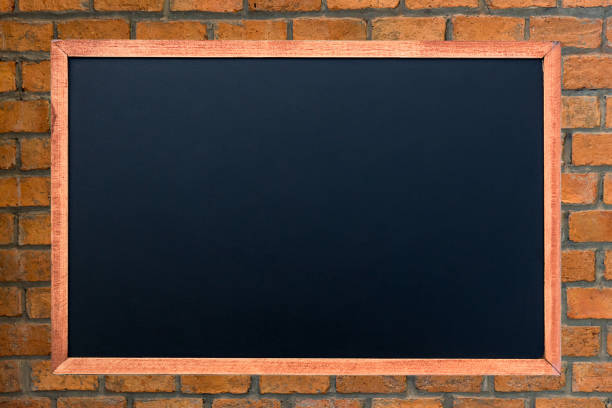 istock Empty green chalkboard texture hang on the brick wall. double frame from green board and brick background. image for background, wallpaper and copy space. bill board wood frame for add text. 1327066261