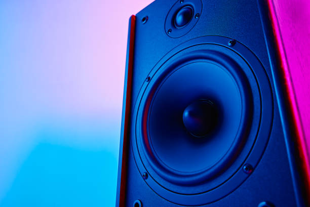 Stereo sound speaker on neon colored background Stereo speaker on purple colored background. Sound audio loud speaker with copy space subwoofer photos stock pictures, royalty-free photos & images