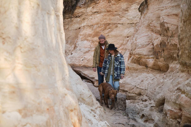 istock Couple walking among the rocks 1327068026