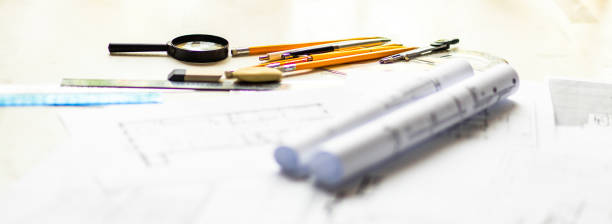 istock Photo of architectural project, blueprints and engineering tools. 1327068419