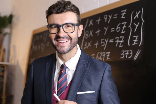 istock Young man in posh uniform with academic background 1327068530