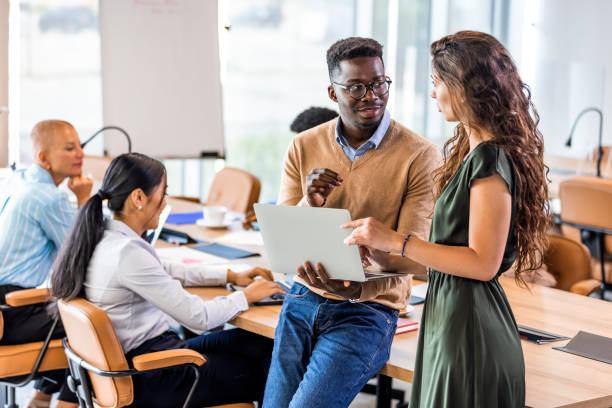 istock Multi ethnic group of businesspeople talking in the office 1327069213