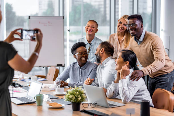 istock Positive multi racial corporate team having a photo session. 1327069543