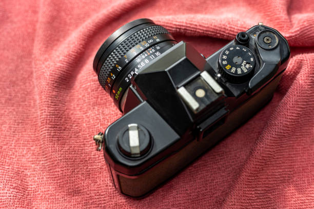 istock Above an old black film camera with a red towel. 1327069675