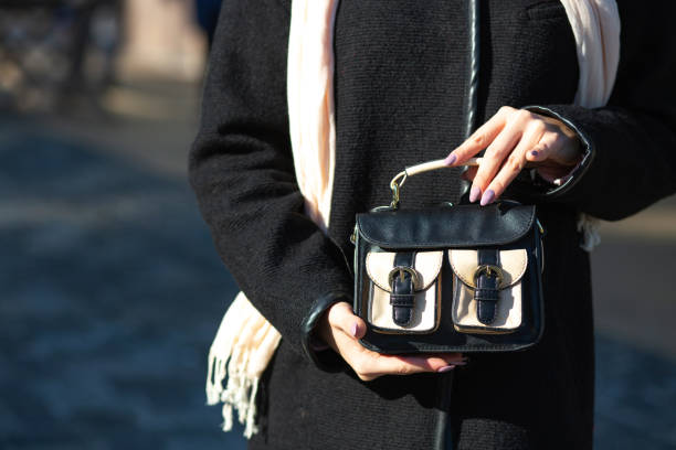 istock Female hand holding small leather purse. Space for text 1327070753