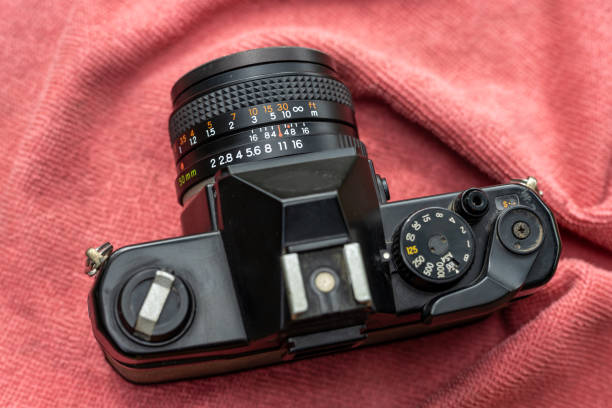 istock Above an old black film camera with a red towel. 1327072522