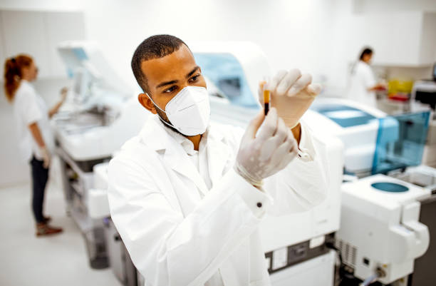 Scientists working in the laboratory Scientists working in the laboratory human centrifuge stock pictures, royalty-free photos & images