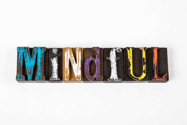 istock Mindful. Colored wooden alphabet blocks on a white background 1327074655