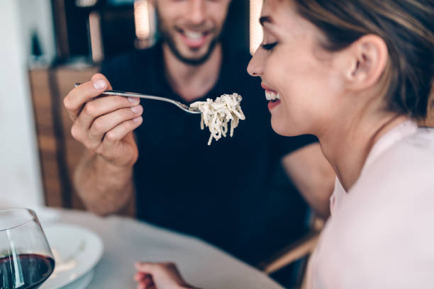 istock Happy couple at hotel restaurant while chef preparing food 1327077138
