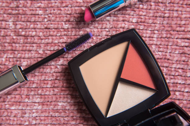 istock Make up face cosmetic kit: mascara, lipstick, foundation concealer, highlighter, color blush. Decorative cosmetics on pink background. Beauty and fashion concept. 1327078630