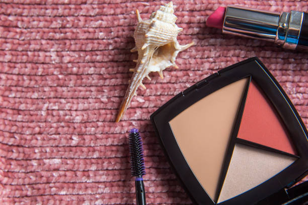 istock Make up face cosmetic kit: mascara, lipstick, foundation concealer, highlighter, color blush. Decorative cosmetics on pink background. Beauty and fashion concept. 1327078652