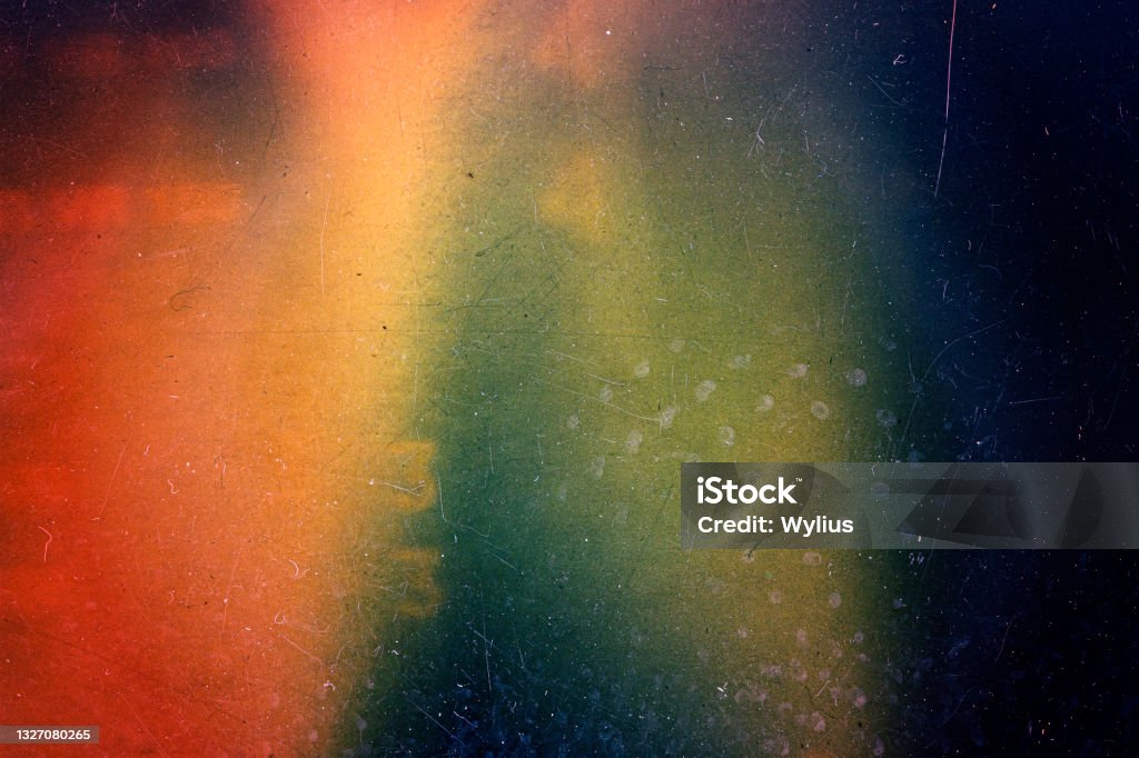 Abstract colorful scratched film background Abstract colorful scratched film texture background with heavy grain, dust and light leak Textured Stock Photo