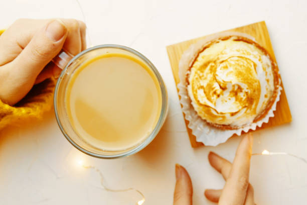 istock Top view of tartlet and coffee on white table. 1327082164