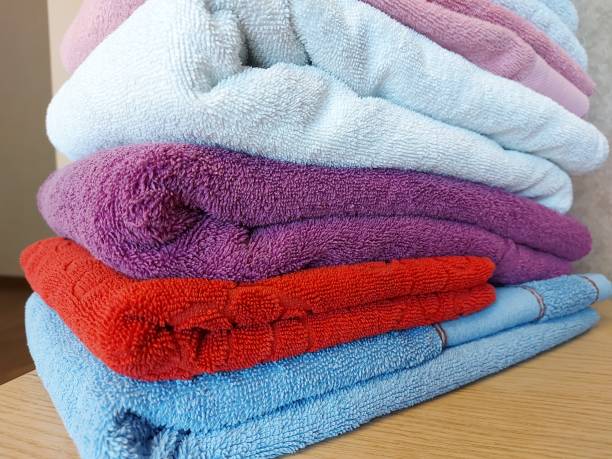 istock Multi-colored cotton terry towels are stacked 1327083396