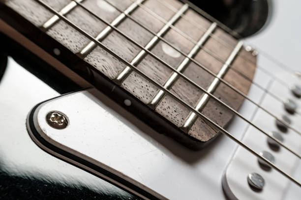 istock Body and neck with strings of a modern, electronic guitar, close-up. 1327083477