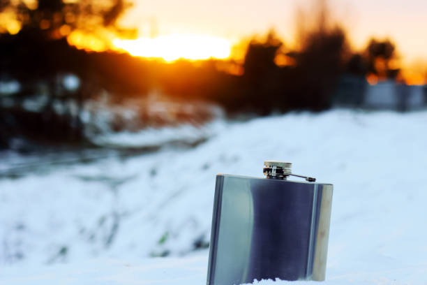 istock metal flask stands in the snow 1327084486