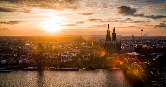 Cologne cityscape at sunset. Cologne Cathedral and other monuments back lit by warm sunlight. Shot in Germany, Europe.