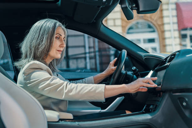 istock Mature beautiful woman in smart casual wear using global positioning system 1327086561