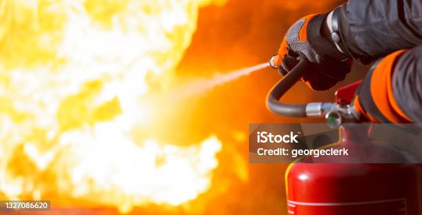 Using A Fire Extinguisher Stock Photo - Download Image Now - Fire Extinguisher, Fire - Natural Phenomenon, Inferno