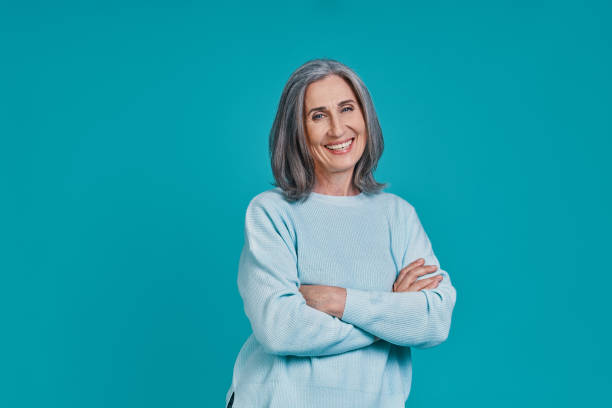 istock Mature beautiful woman looking at camera and smiling 1327089302