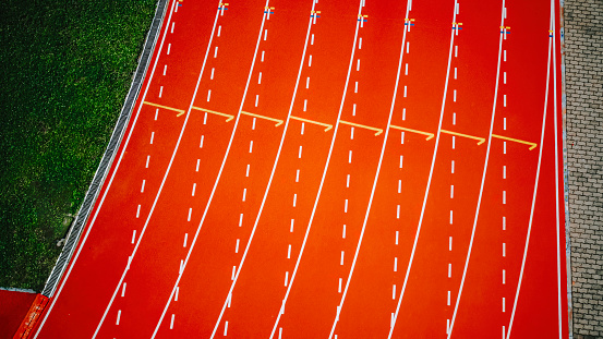 directly above drone point of view starting line all weather track and field stadium in the morning