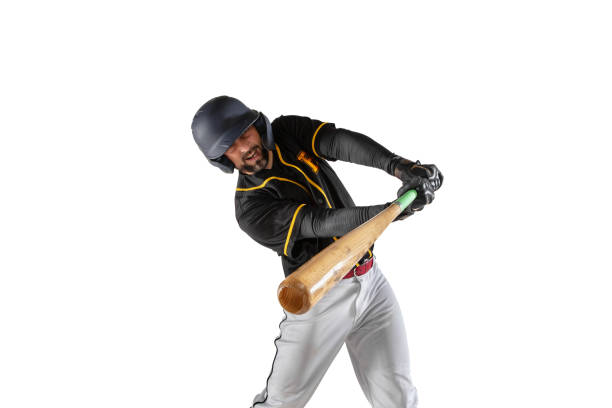 istock Close-up baseball player, pitcher in a black white sports uniform practicing isolated on a white studio background. 1327093333