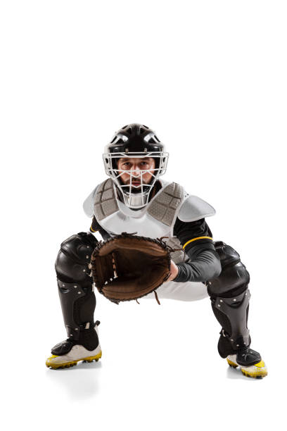 baseball player, catcher in white sports uniform and equipment practicing isolated on a white studio background. - baseballs baseball baseball catcher catching imagens e fotografias de stock