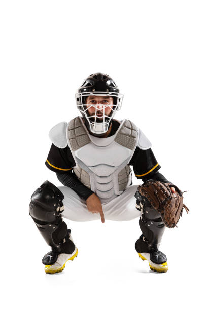 istock Baseball player, catcher in white sports uniform and equipment practicing isolated on a white studio background. 1327093339