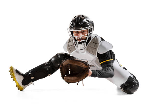 istock Baseball player, catcher in action in white sports uniform and equipment practicing isolated on a white studio background. Side view 1327093344