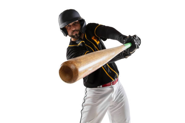istock Close-up baseball player, pitcher in a black white sports uniform practicing isolated on a white studio background. 1327093364