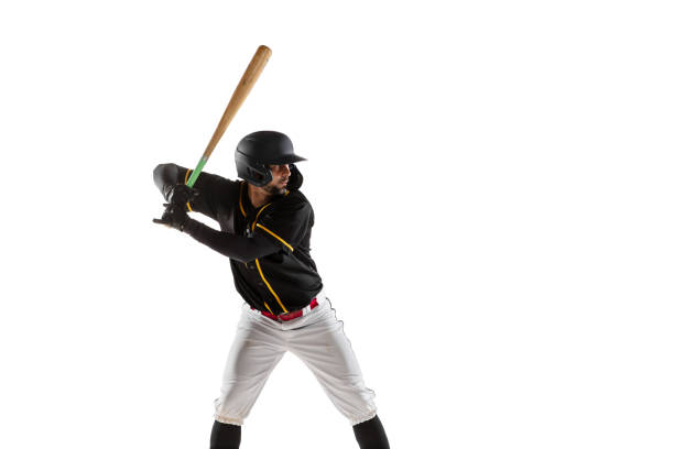 istock Baseball player, pitcher in a black white sports uniform practicing isolated on a white studio background. 1327093371