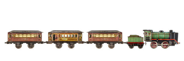Rusted and weathered toy passenger train with locomotive isolated on white Vintage rusted and weathered toy passenger train with locomotive isolated on a white background miniature train stock pictures, royalty-free photos & images