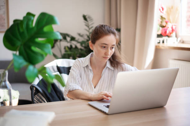istock Young female student freelancer working at home using laptop 1327095248