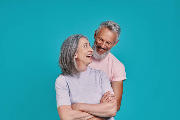 istock Happy senior couple bonding and smiling 1327098243