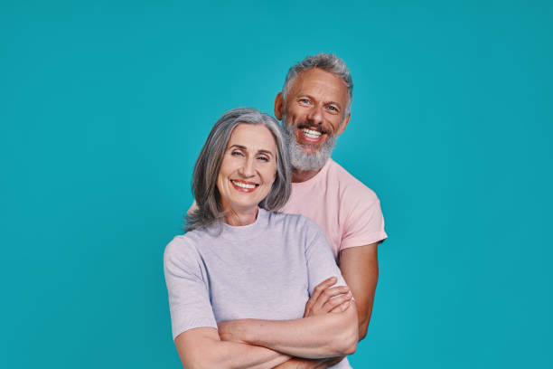 istock Beautiful senior couple looking at camera and smiling 1327098475