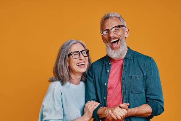 istock Happy senior couple in eyeglasses smiling 1327098667