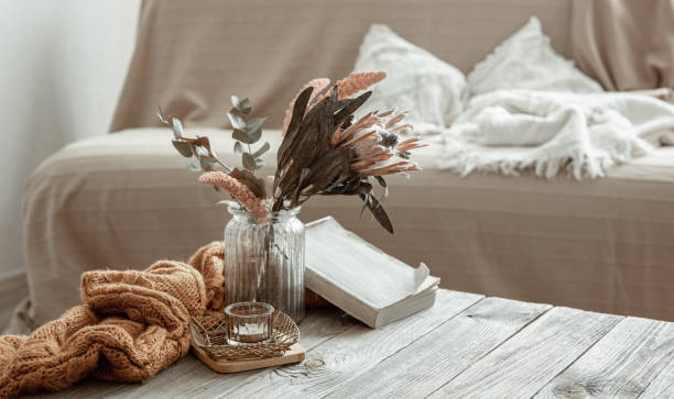 istock Cozy home still life with a book and decorative elements. 1327102108