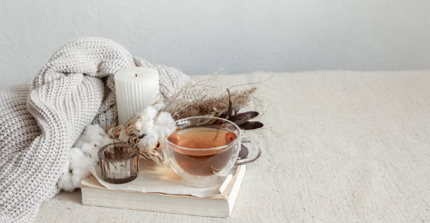 istock Cozy composition with tea, dried flowers and home decor details. 1327102304