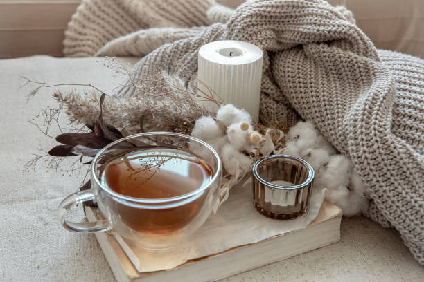 istock Cozy composition with tea, dried flowers and home decor details. 1327102315