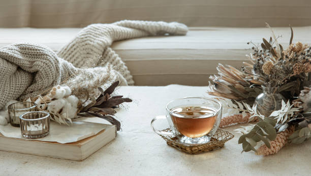istock Cozy composition with a cup of tea, dried flowers and decorative elements. 1327102319