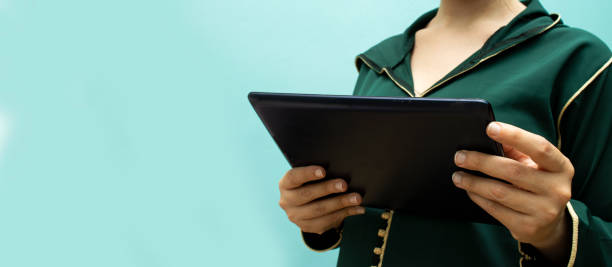 istock close up hands woman using tablet, laptop and cellphone connecting wifi 1327104751