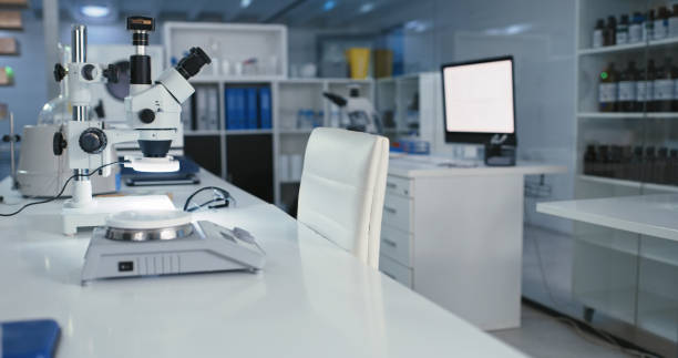 istock Shot of a microscope and computer in a modern laboratory 1327105531