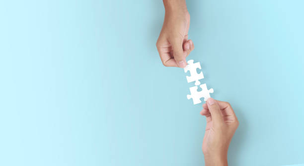 istock Holds in hand  jigsaw puzzle. Business solutions success 1327105552