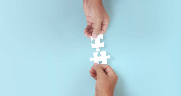 istock Holds in hand  jigsaw puzzle. Business solutions success 1327105564