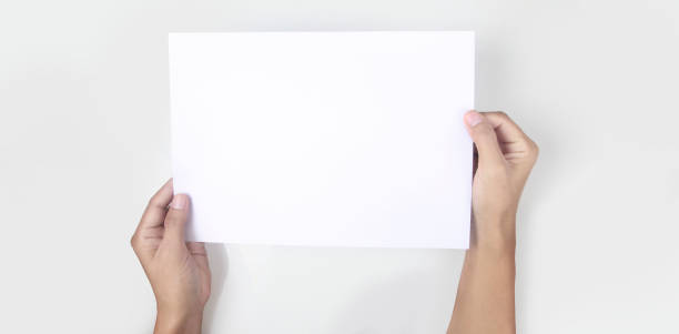 istock Hands holding paper blank for  letter paper 1327105566