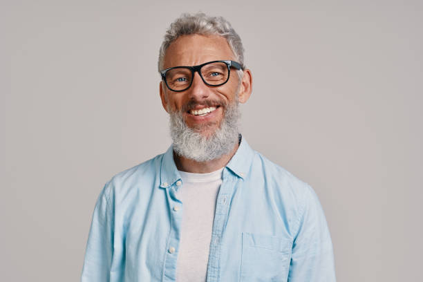 istock Handsome senior man in eyeglasses looking at camera and smiling 1327106646