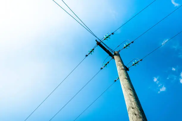 Photo of Clouds against blue sky with telegraph pole