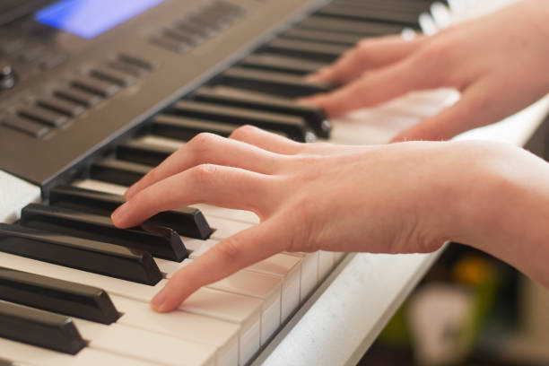 istock A person playing a synthesizer. 1327107219