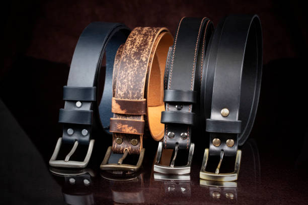 istock Group of leather belts on a dark background. 1327108729